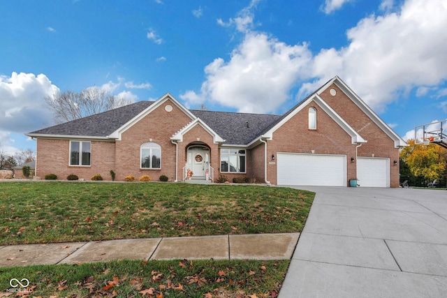 view of front facade with a garage and a front lawn