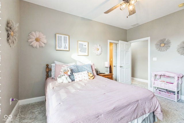 bedroom with ceiling fan and light carpet