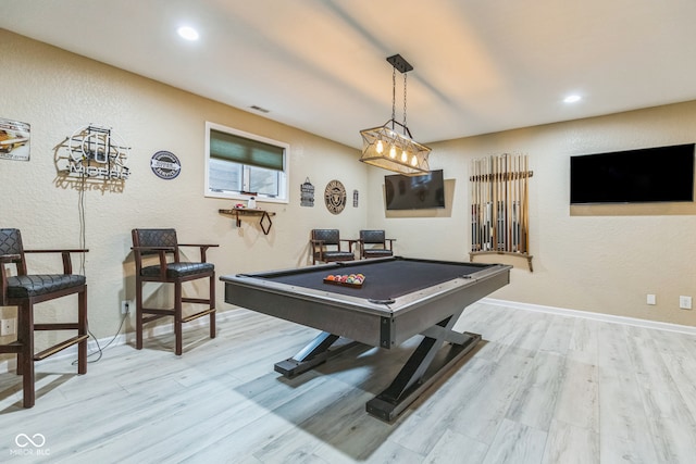 rec room with light hardwood / wood-style floors and pool table