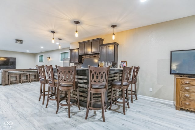 dining area with light wood-type flooring