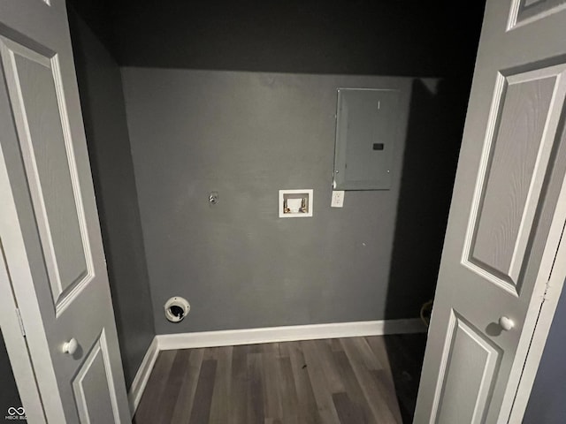 washroom featuring electric panel, hookup for a washing machine, and dark wood-type flooring