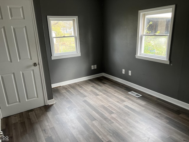 spare room with light hardwood / wood-style floors