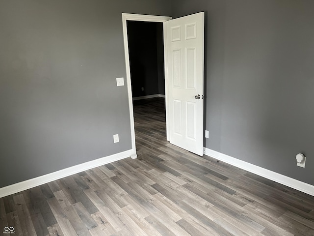 empty room featuring wood-type flooring