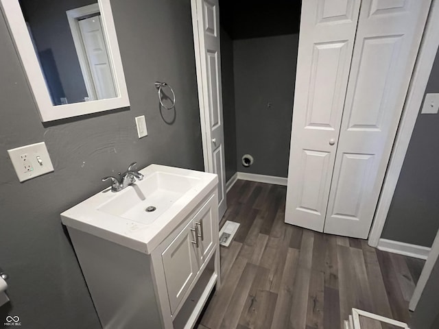 bathroom with vanity and wood-type flooring