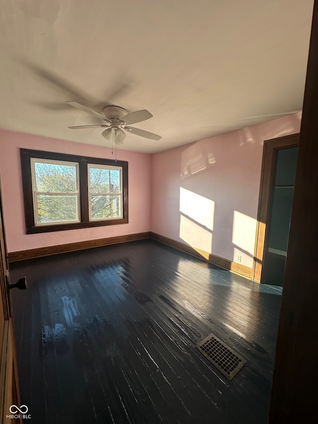 unfurnished room with hardwood / wood-style floors and ceiling fan