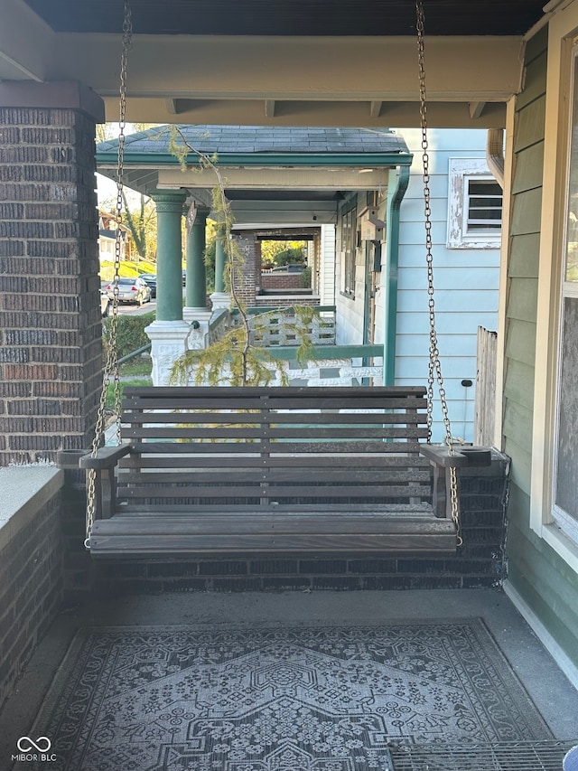 entrance to property featuring covered porch