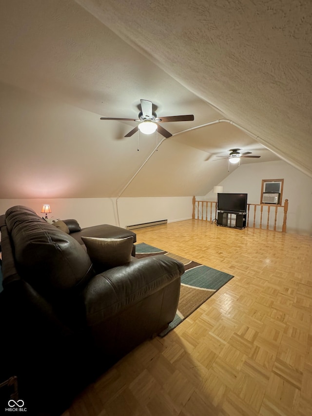 interior space with ceiling fan, a textured ceiling, light parquet flooring, a baseboard heating unit, and lofted ceiling