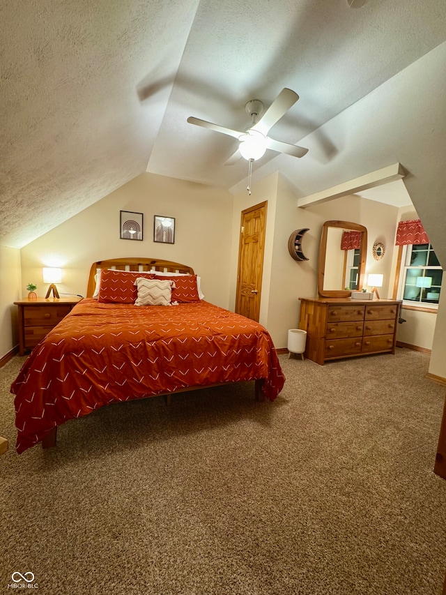 bedroom featuring a textured ceiling, carpet floors, ceiling fan, and lofted ceiling