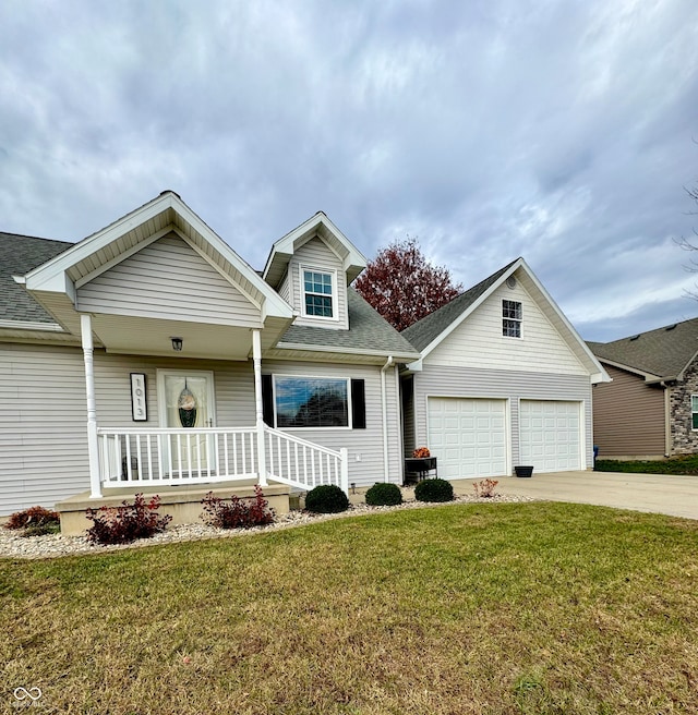 view of front facade with a garage, a front yard, and covered porch