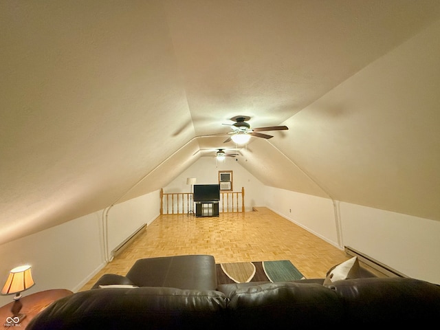 bonus room featuring light parquet flooring, a baseboard radiator, lofted ceiling, and ceiling fan