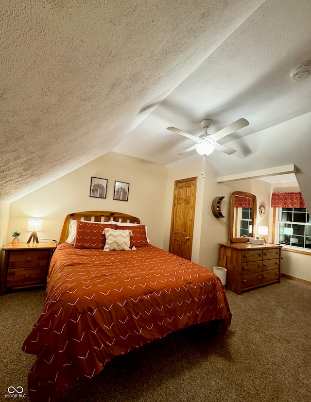 bedroom featuring vaulted ceiling, ceiling fan, a textured ceiling, and dark carpet