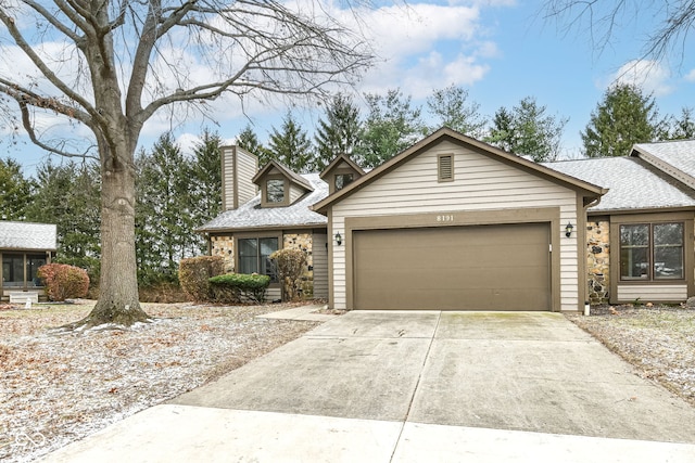 ranch-style home with a garage