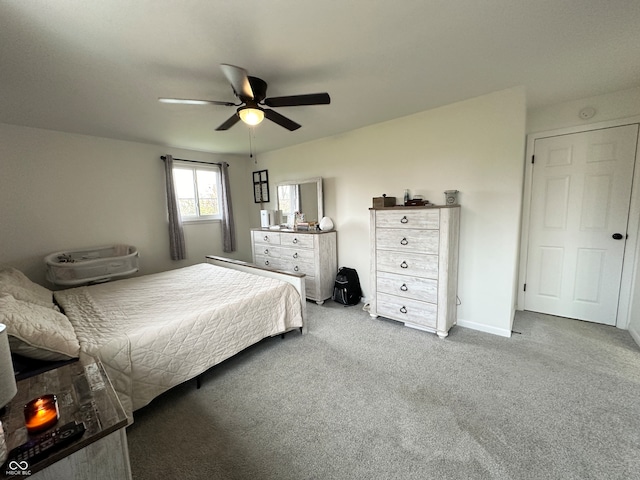 bedroom with ceiling fan and carpet flooring