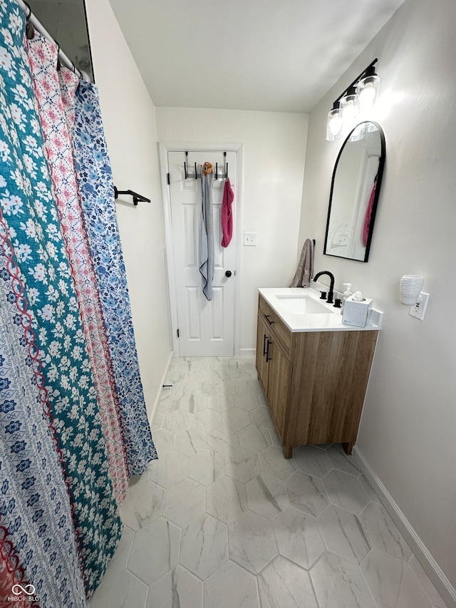 bathroom featuring curtained shower and vanity