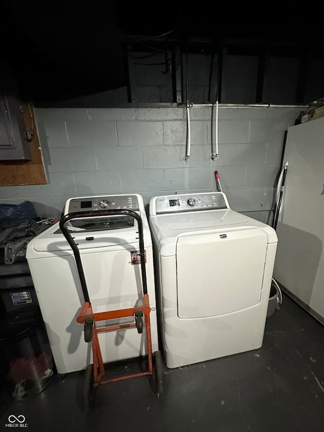 laundry area with washing machine and dryer