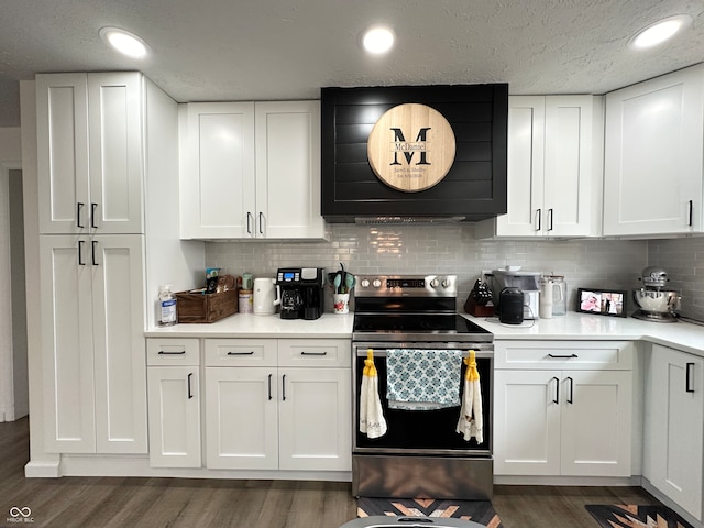 kitchen with white cabinetry, backsplash, dark hardwood / wood-style flooring, and electric stove