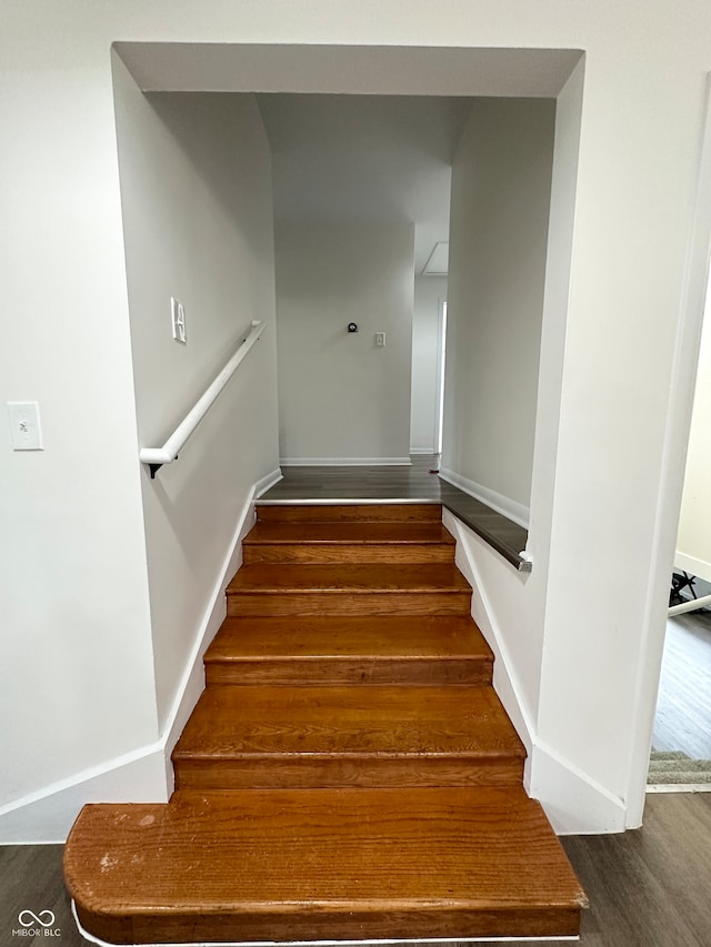 stairway featuring hardwood / wood-style flooring