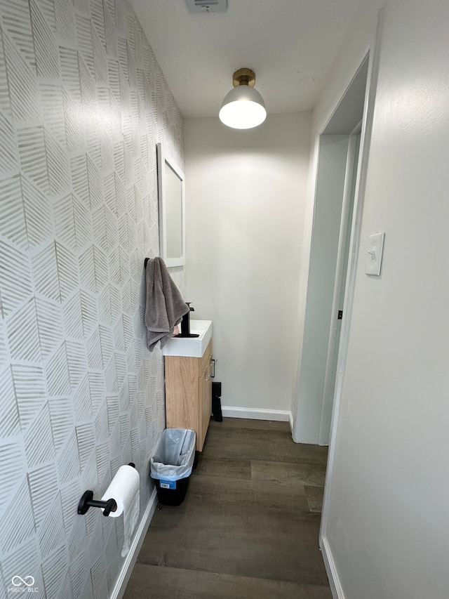 hallway with dark hardwood / wood-style floors