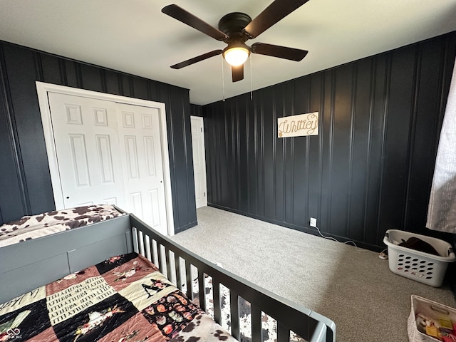 bedroom featuring carpet flooring, ceiling fan, and a closet