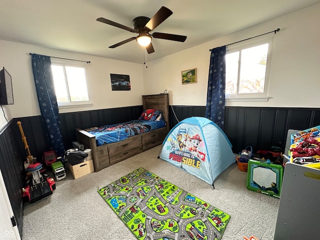 carpeted bedroom with ceiling fan