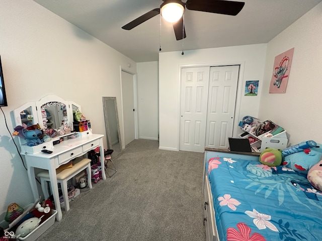 carpeted bedroom with a closet and ceiling fan