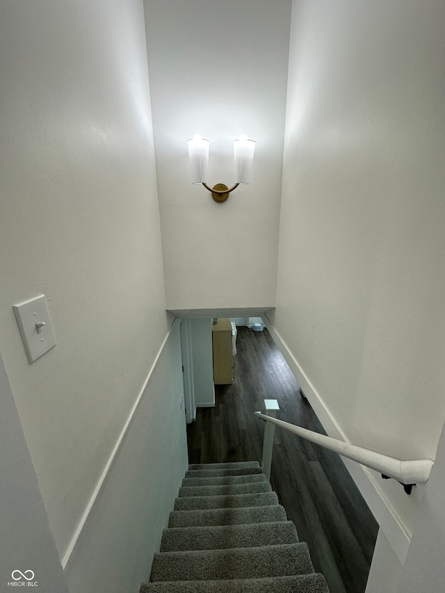 stairs featuring wood-type flooring