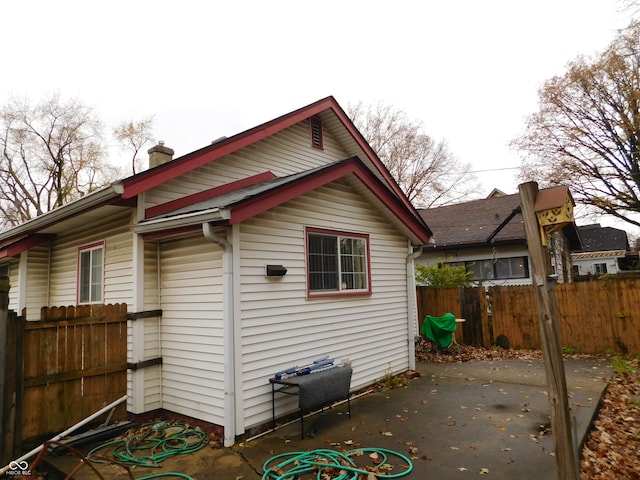 view of side of property featuring a patio area