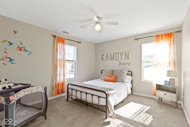 carpeted bedroom featuring ceiling fan