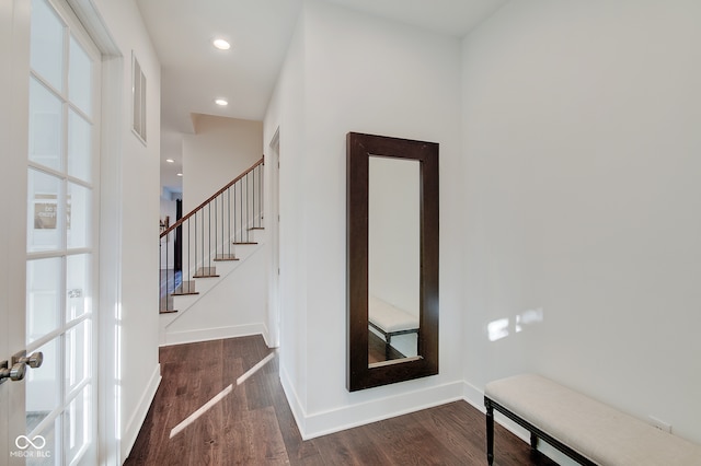 stairway featuring wood-type flooring