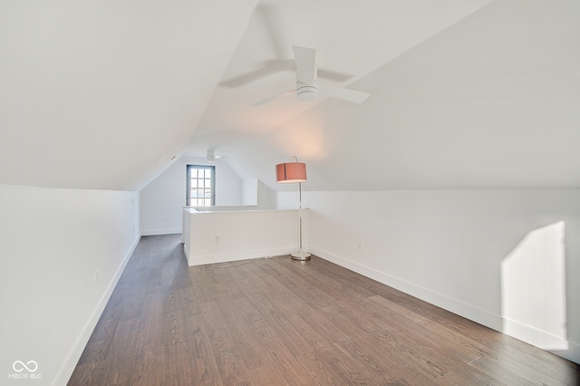 additional living space featuring lofted ceiling, hardwood / wood-style floors, and ceiling fan