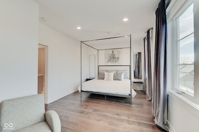 bedroom with hardwood / wood-style floors