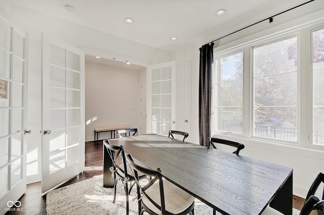 dining area with french doors and dark hardwood / wood-style floors