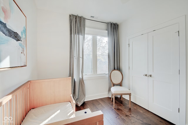 sitting room featuring dark hardwood / wood-style floors