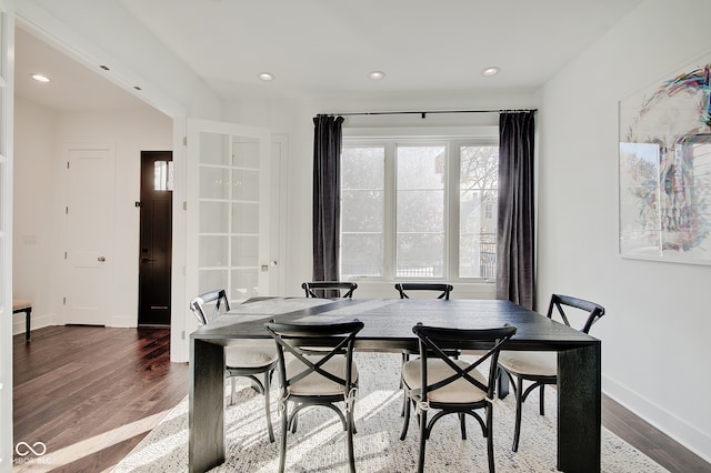 dining space featuring dark hardwood / wood-style floors