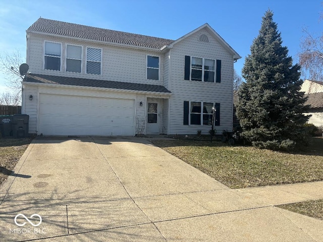 traditional-style home with concrete driveway and an attached garage