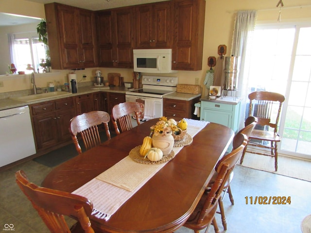 kitchen featuring white appliances and light countertops