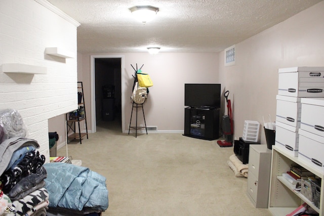 interior space featuring a textured ceiling and light carpet