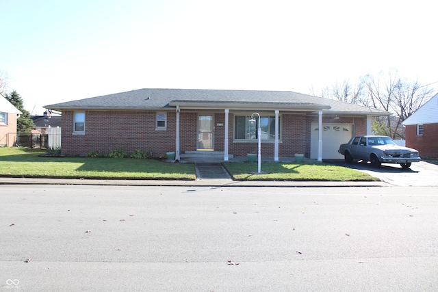 single story home with a garage and a front yard