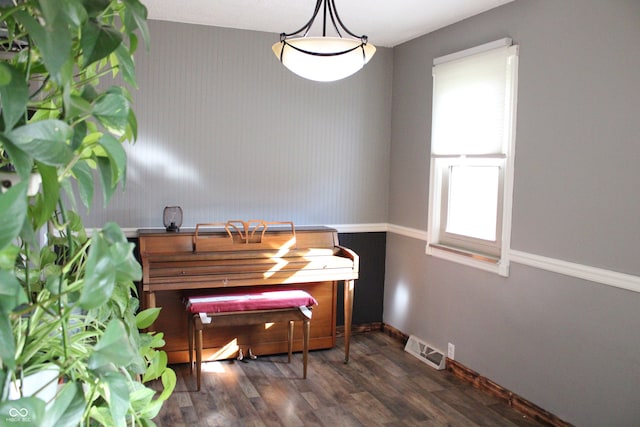 dining space with dark hardwood / wood-style floors