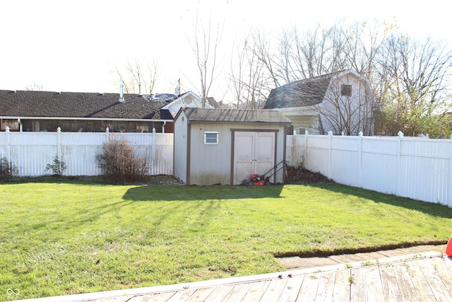 view of yard featuring a storage shed and a deck