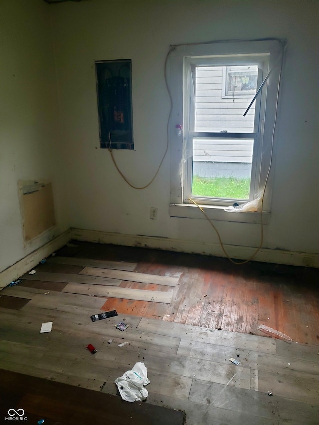 unfurnished room with wood-type flooring