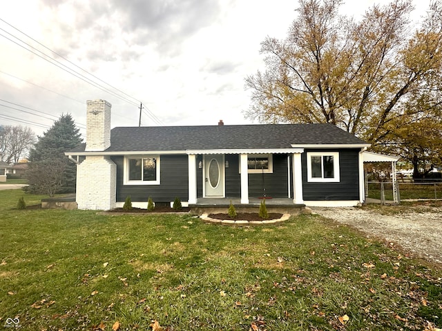 single story home with a porch and a front yard