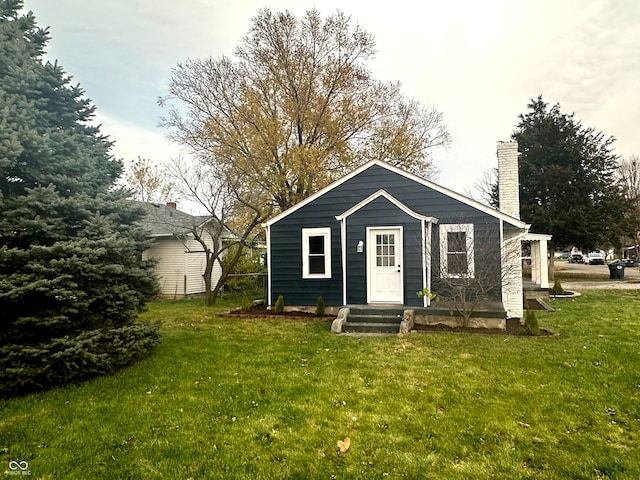 view of outbuilding with a yard