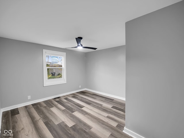 spare room featuring ceiling fan and hardwood / wood-style floors