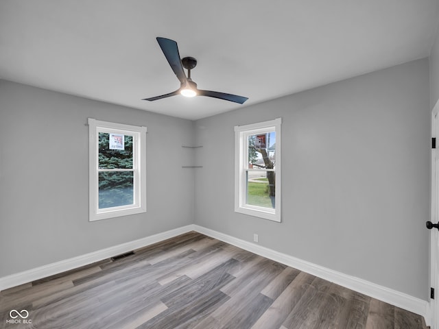 unfurnished room featuring light wood-type flooring and ceiling fan