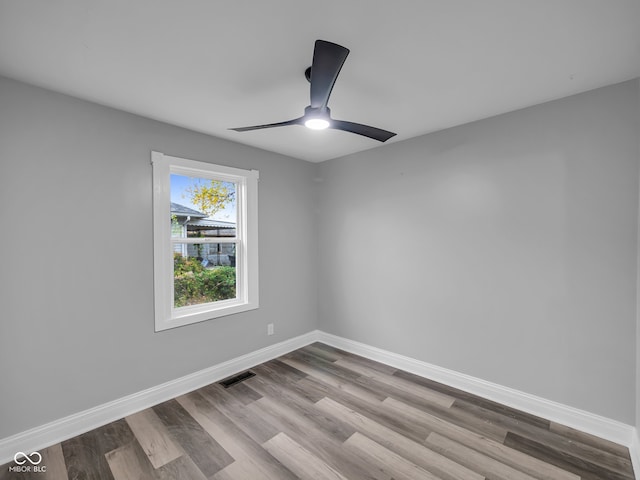 empty room with light hardwood / wood-style floors and ceiling fan