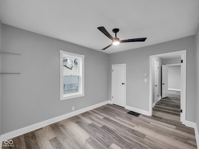 unfurnished bedroom featuring light hardwood / wood-style floors and ceiling fan