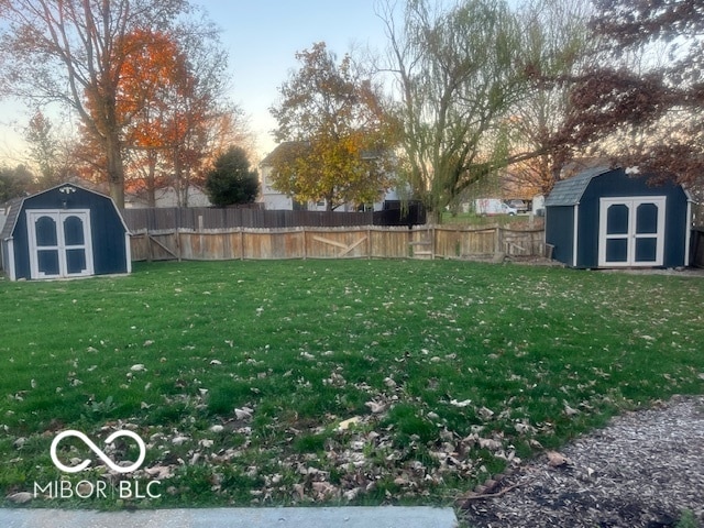 yard at dusk with a storage unit