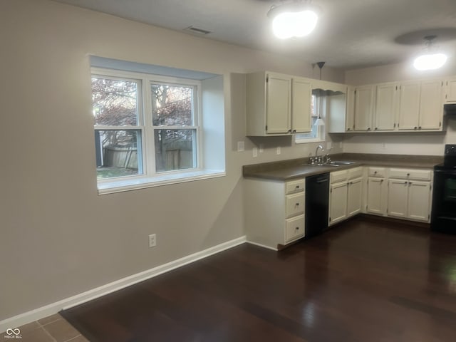 kitchen with white cabinetry, sink, black appliances, and dark hardwood / wood-style flooring