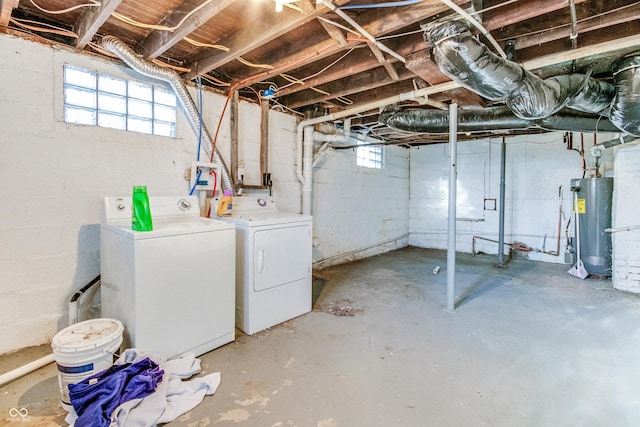 basement with independent washer and dryer and water heater